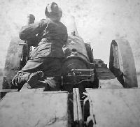 Training one of H.M.S. Monarch's 4.7 guns on the Pretoria Forts 4th June 1900.